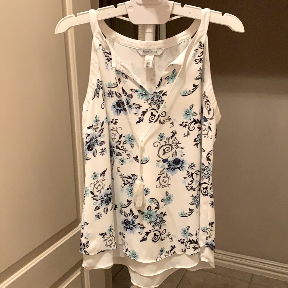 Sleeveless white with floral design blouse